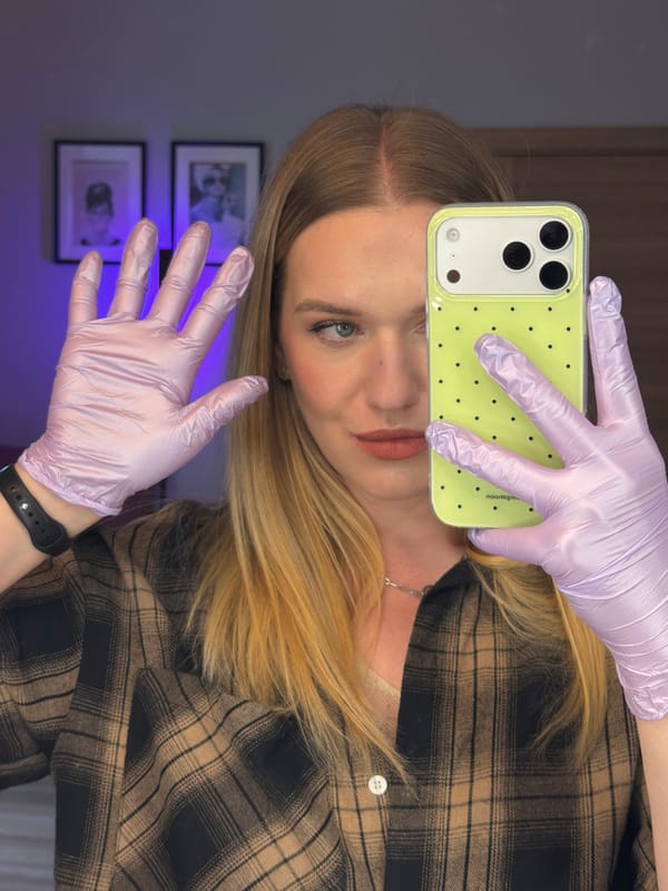 Person takes selfie with polka-dot phone in Riga