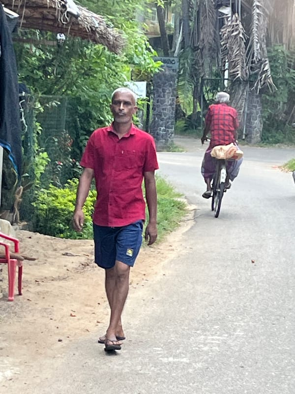 Morning commute on foot and motorcycle in coastal Sri Lanka