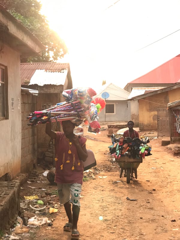 Daily street commerce and residential life documented in Dutsen Alhaji