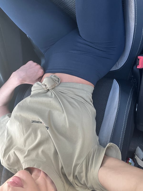 Person in Saint Laurent shirt observed sitting in vehicle
