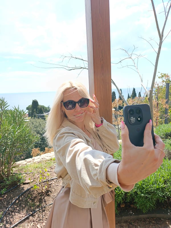 Woman takes selfie in seaside landscape area in Alupka