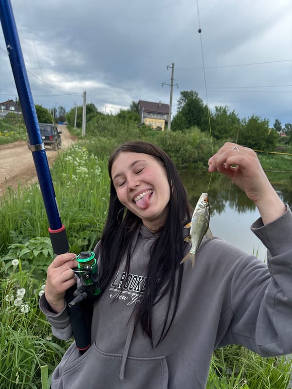 Two women enjoy fishing trip at Russian lake
