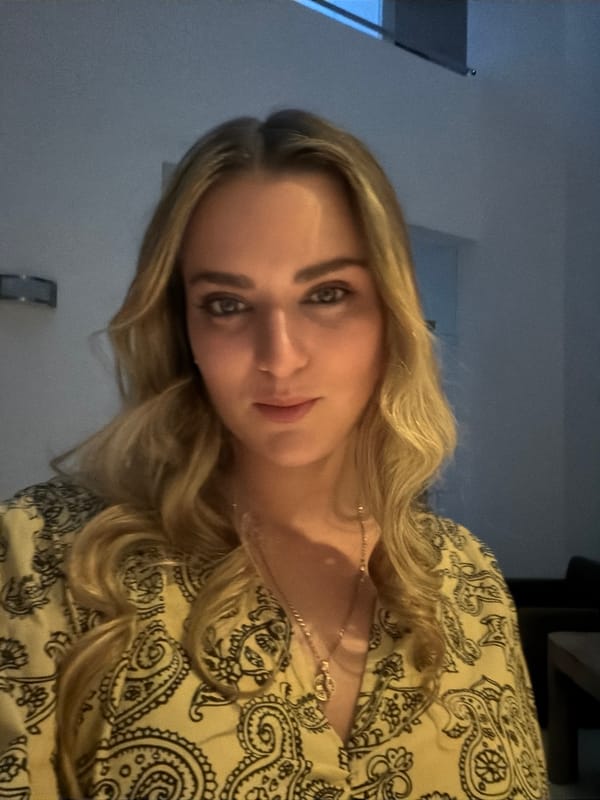 Woman photographed in yellow paisley blouse, Mexico