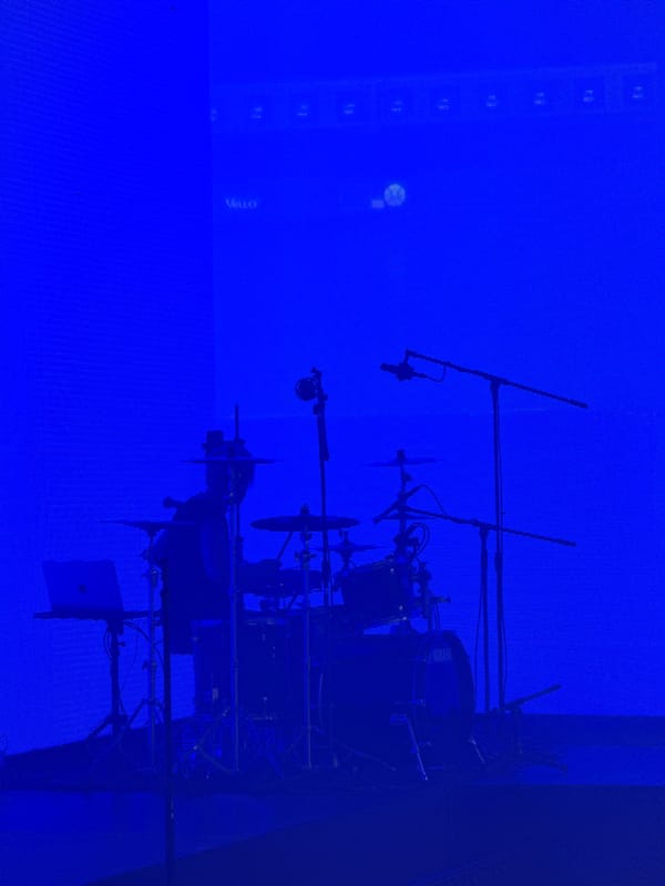 Drum set spotted under blue lights in Saint Petersburg