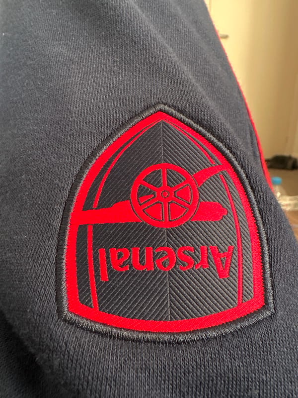 Arsenal crest and costumed woman observed in Shotton