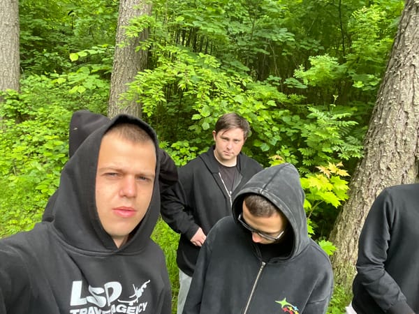 Young men hike forest paths in Krasnye Baki, Russia