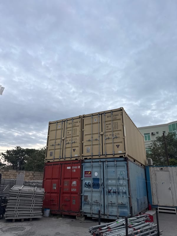 Event production yard in Baku, complete with gear, containers, and dogs