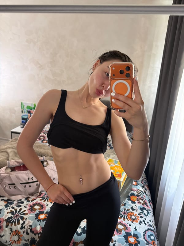 Woman takes morning mirror selfies in Pernik bedroom