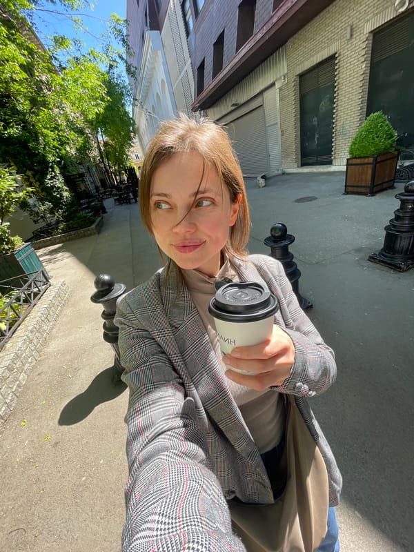 Woman documents sunny coffee walk through historic Subotica streets
