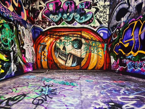 Graffiti-saturated tunnels and alleys, urban streets at night