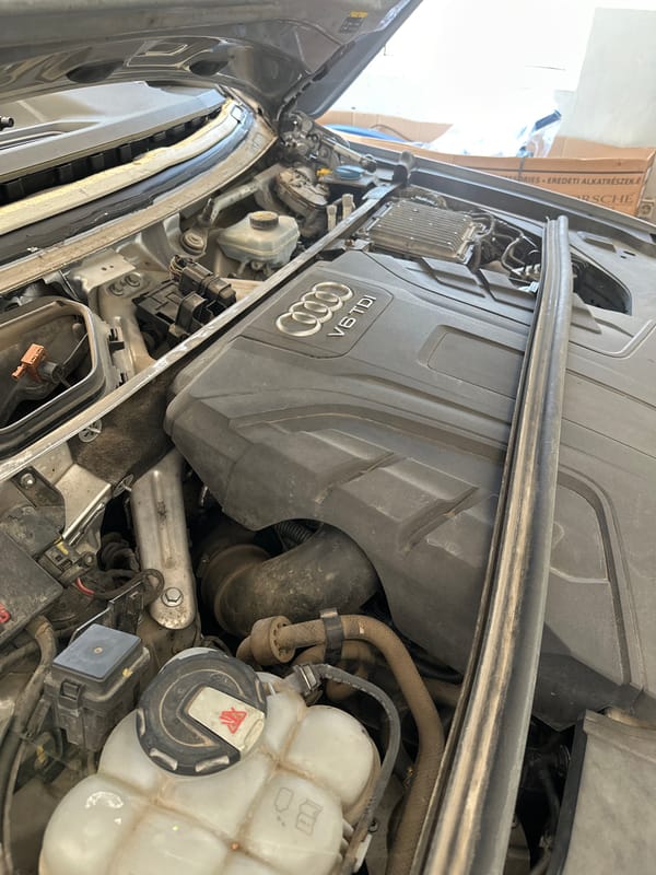 Automotive repair shop services multiple Audi vehicles, motorcycle