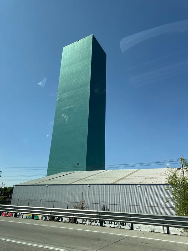 Green gridded building photographed in Santa Ana Xalmimilulco