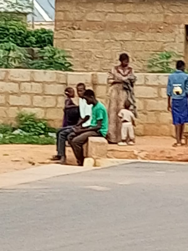 Morning street life in Tempure, Nigeria — on foot and two wheels