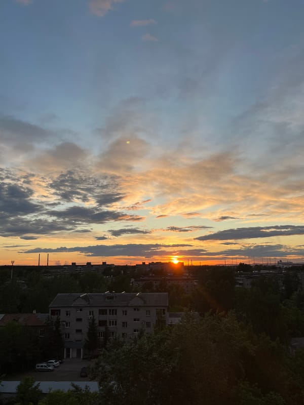 Urban sunset captured by multiple witnesses in unidentified city