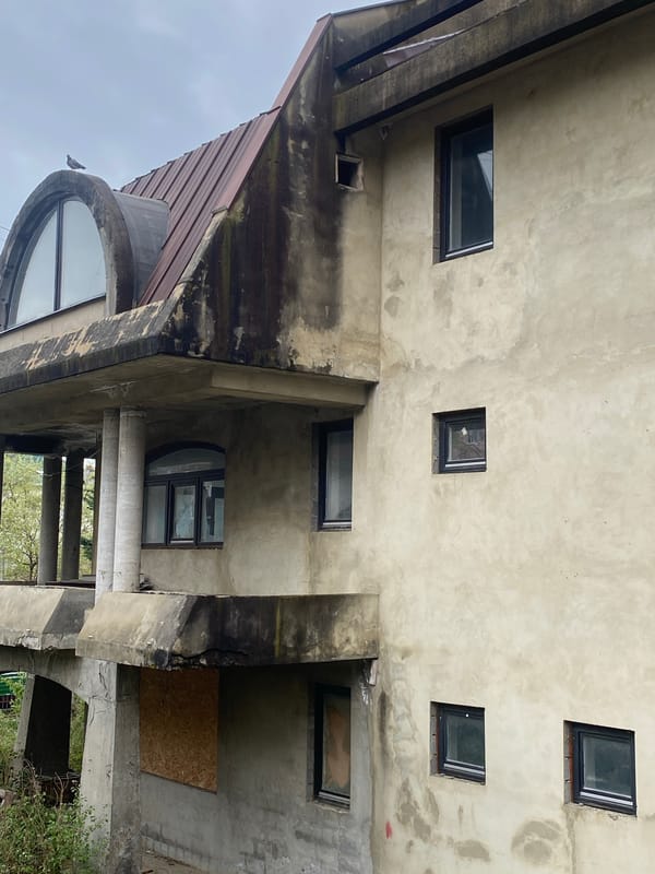 Child photographed at concrete residential buildings in Sochi, Russia