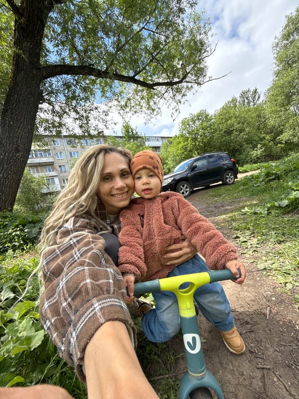 Woman and child photographed together outside in Rusanovo, Russia