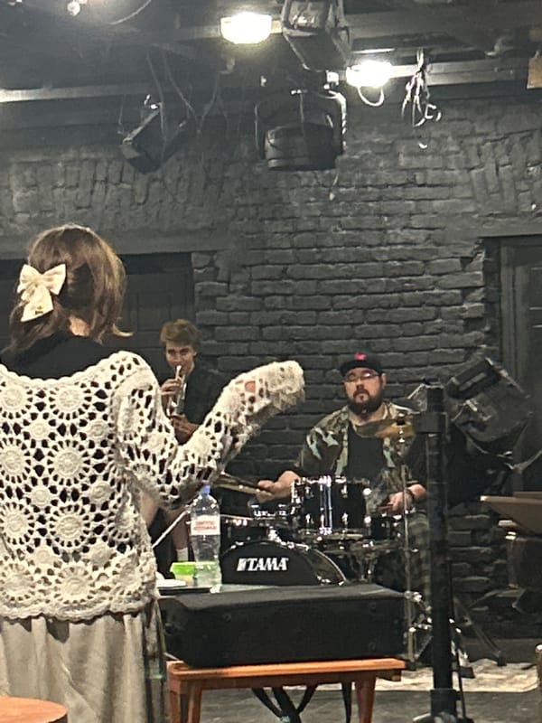 Live jazz performance captured in brick-walled venue