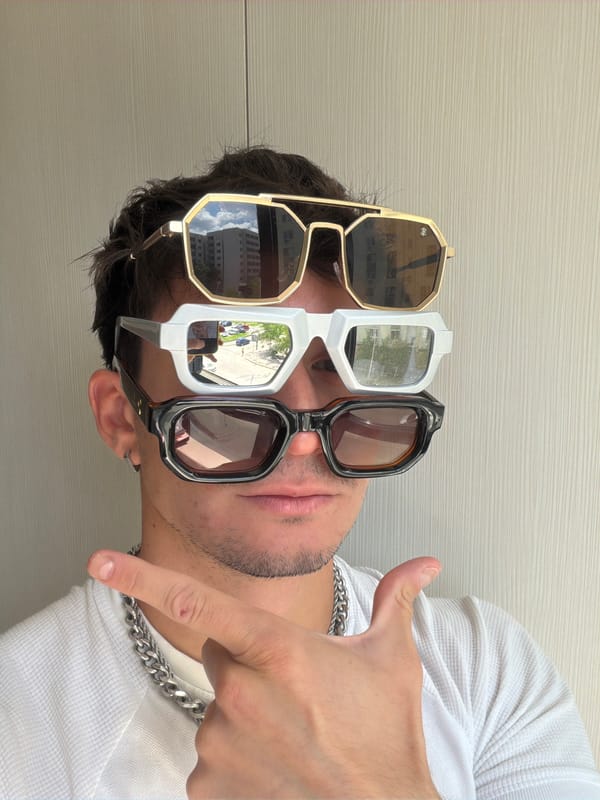Man wears three pairs of sunglasses in Sofia fashion photos
