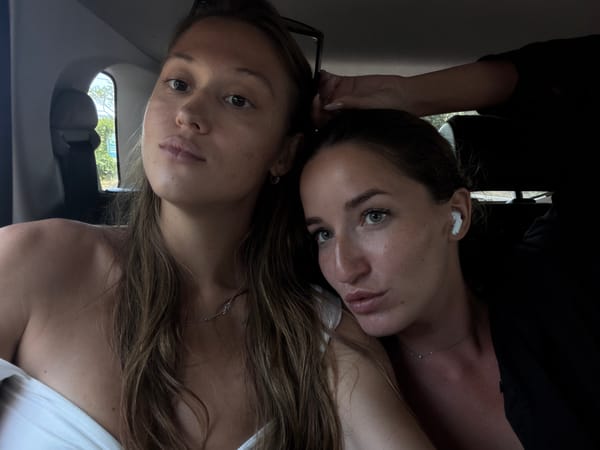 Two women photographed upside down in car in Karangasem