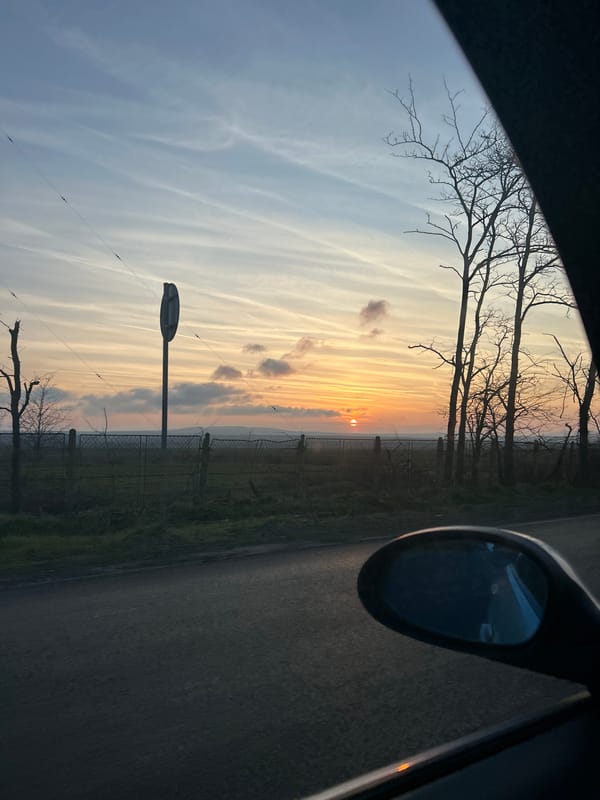 Sunrise or sunset observed from vehicle near Aytos, Bulgaria