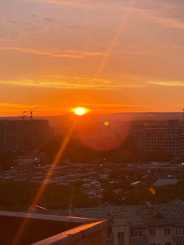 Warm sunset over Irkutsk, sky lit orange and pink