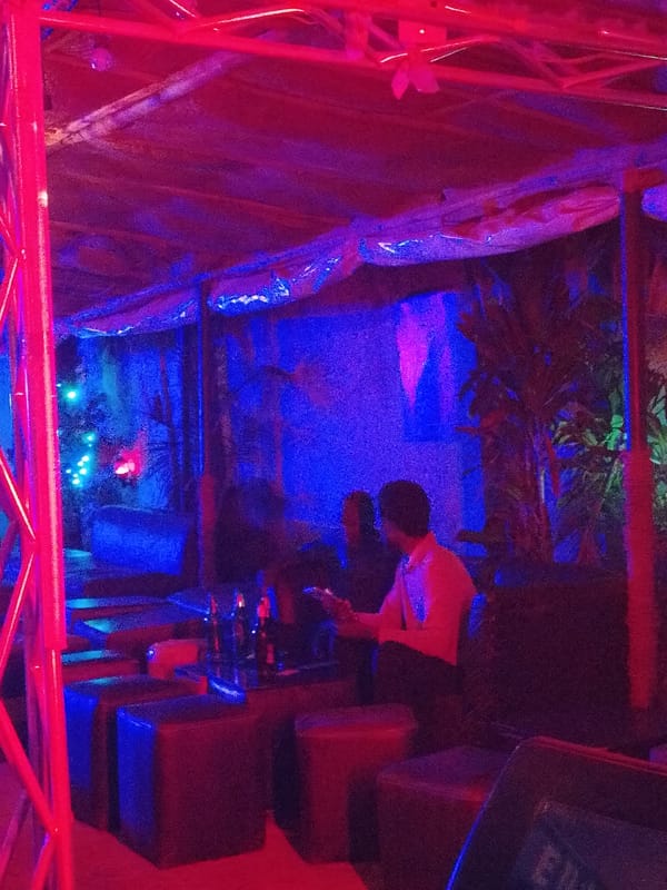Evening bar scene captured under neon lighting