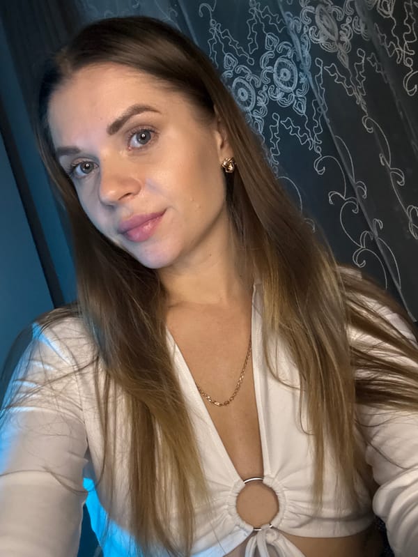 Woman takes multiple selfies around Batumi during evening photo session