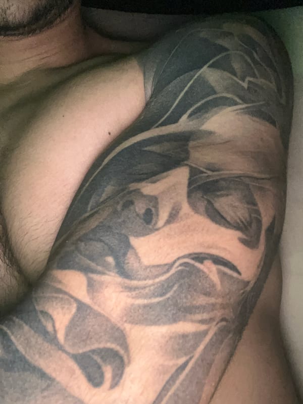 Close-up view of person's arm and shoulder documented