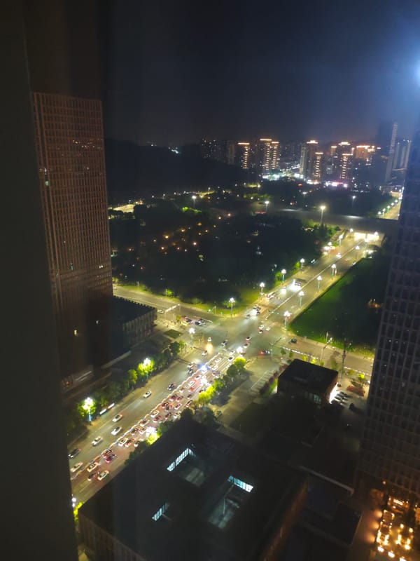 Nighttime city view captured from high vantage point in Liangjiang