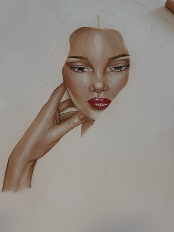 Artist works on face-and-hand drawing in Milan studio