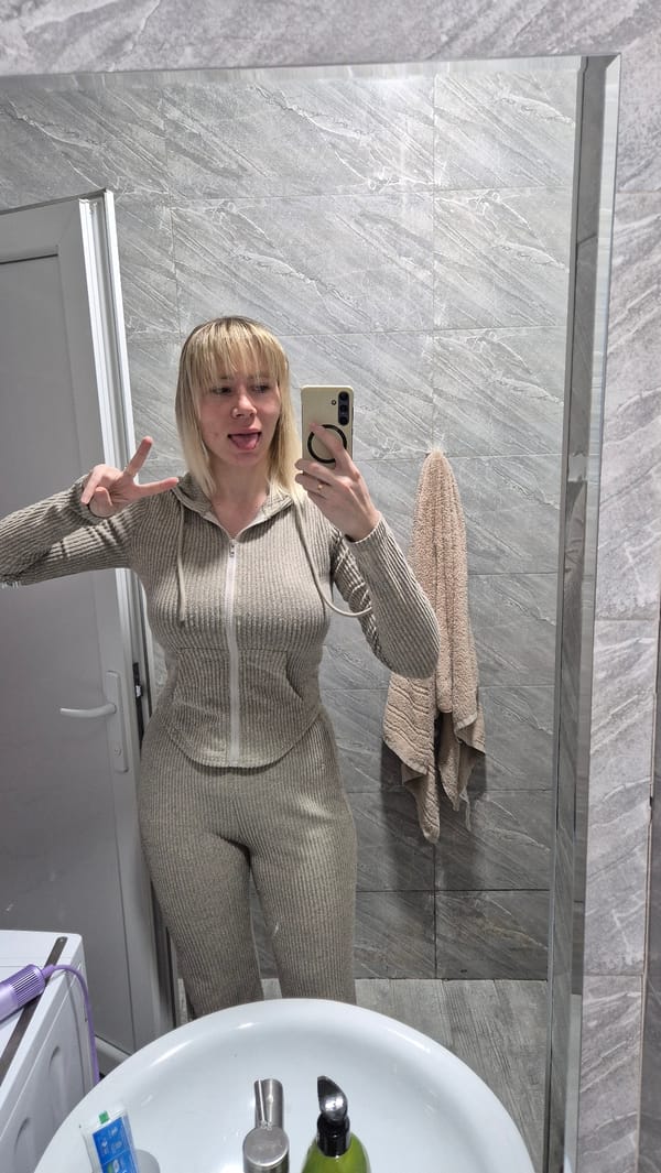 Woman documents morning routine with selfies in Batumi home