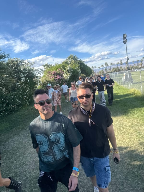 Two men attend outdoor event in Indio