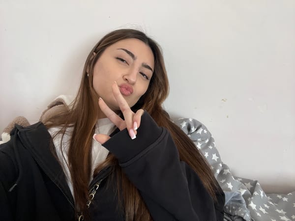 Woman takes morning selfie with peace sign in Yerevan