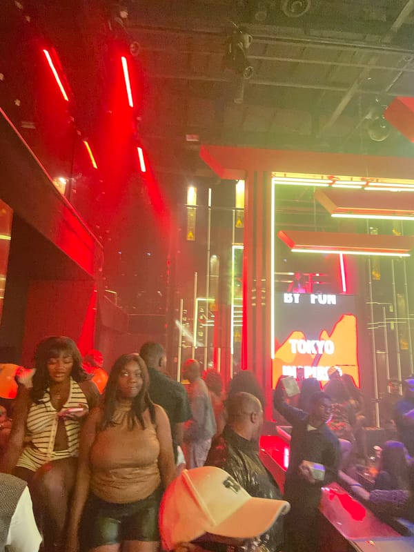 Late-night club scene in Abuja, lights and dancing