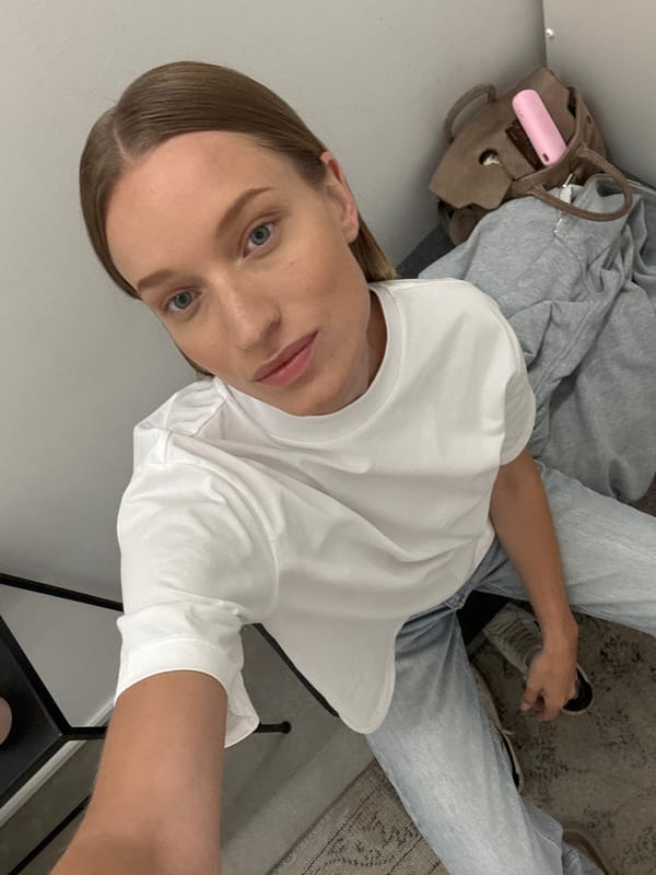 Woman takes selfie in German boutique changing room