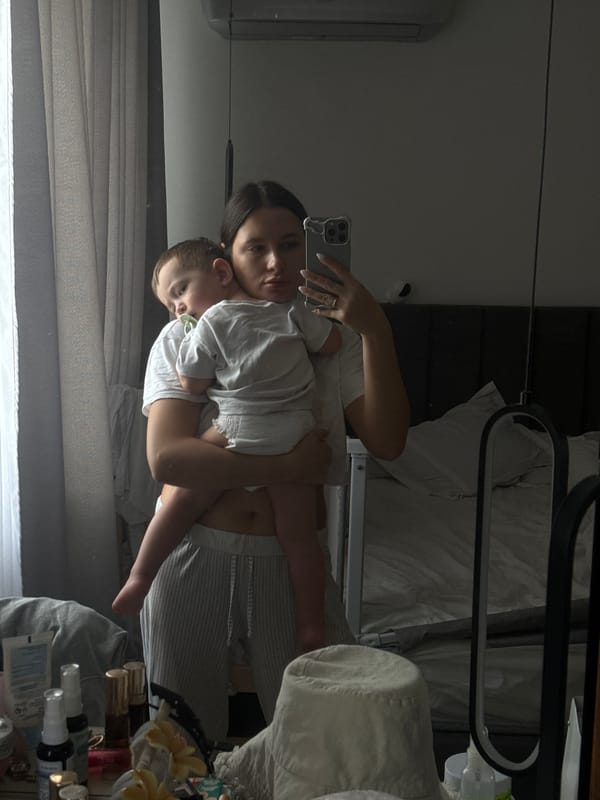 Woman with child photographed indoors in Odintsovo, Russia