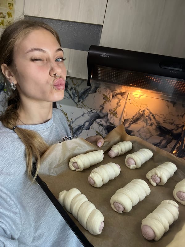 Woman prepares pigs in blanket for early morning baking
