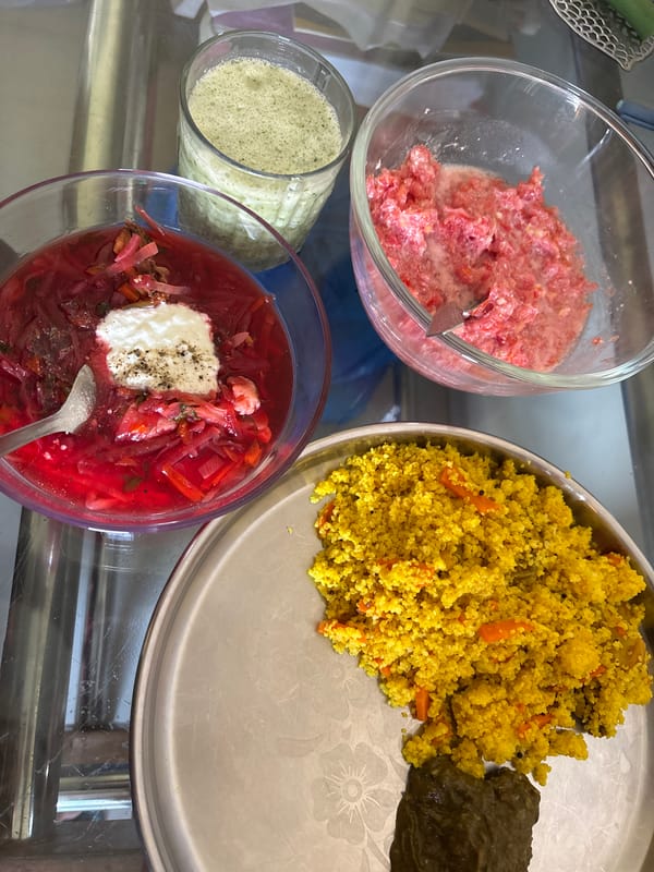 Food dishes arranged on glass table in Ambernath