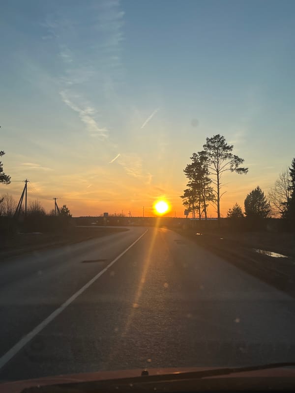 Sunset documented on rural road in Гаревая, Russia