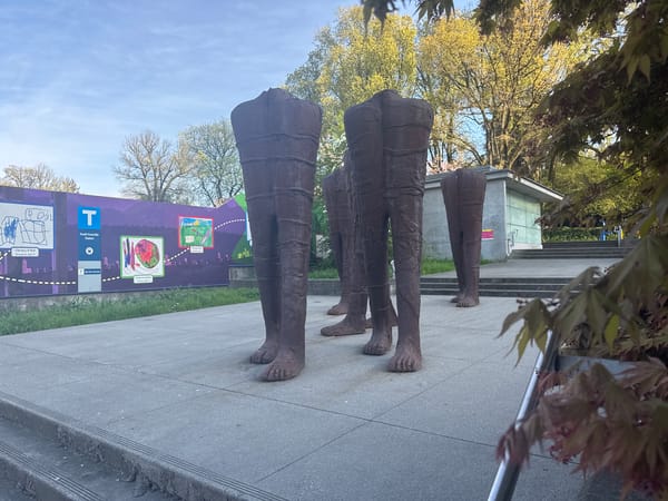 Bronze leg sculptures documented at Vancouver transit plaza
