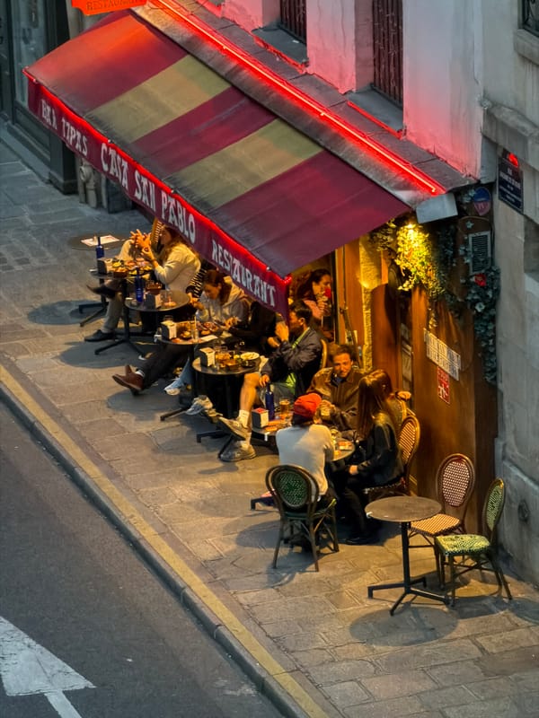 Evening street life documented in central Paris