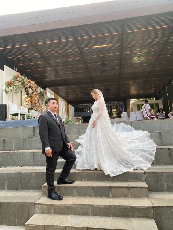 Outdoor wedding ceremony on stone steps in Bekasi