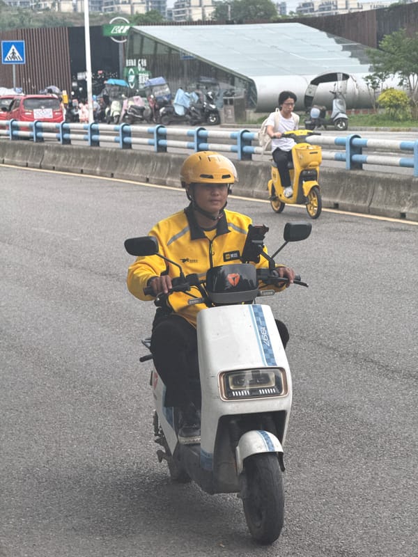 Electric motorcycle rider spotted in yellow gear in Liangjiang, China