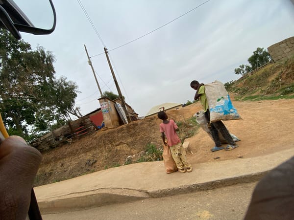 Street scenes documented in Bukuru, Nigeria under overcast skies