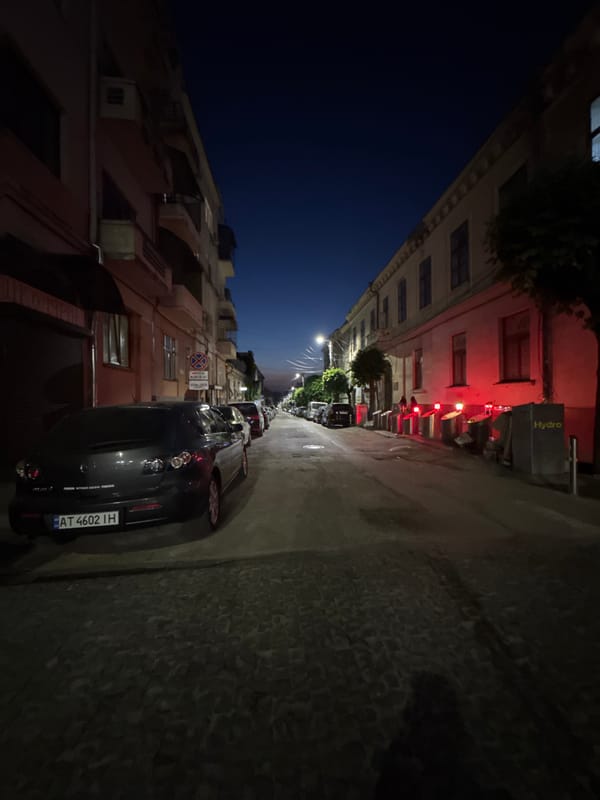 Evening streets of central Chernivtsi, bollards and landmarks lit up