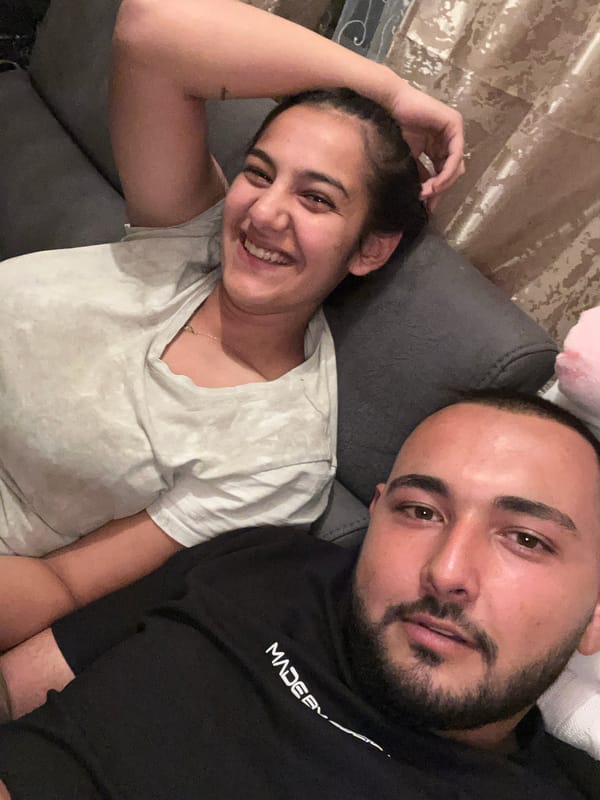 Couple shares relaxed moment on couch in Bulgarian village