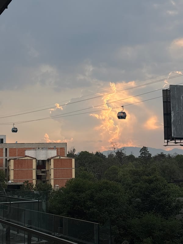 Cable cars operate in Mexico City under cloudy skies