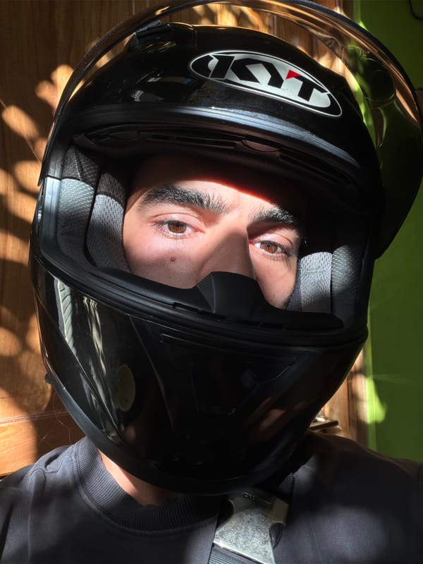 Motorcyclist observed during daytime ride through North Kuta streets