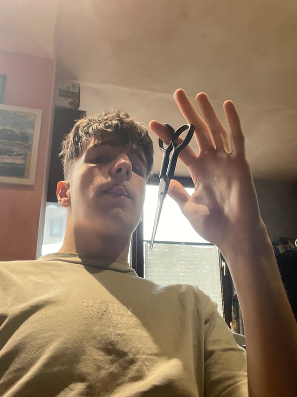 Person poses with scissors during indoor photo session in Burgas