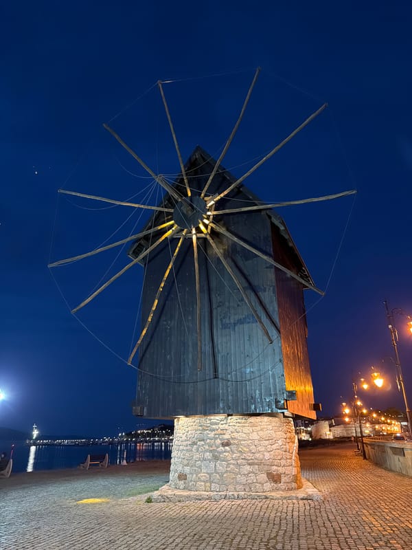 Evening tourism activity centers around historic Nesebar windmill landmark